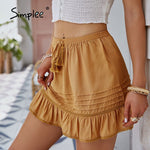 Load image into Gallery viewer, Simplee Holiday lace up ruffled mini skirt summer women Tassel hollow out elastic waist short skirt Casual solid fashion bottom
